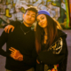 Teen boy and girl standing together hugging