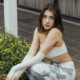 Pretty teen girl kneeling outside