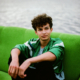 Teen boy sitting on sofa