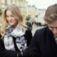 young man and women walking holding hands